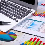 Graphs, charts, business table. The workplace of business people.